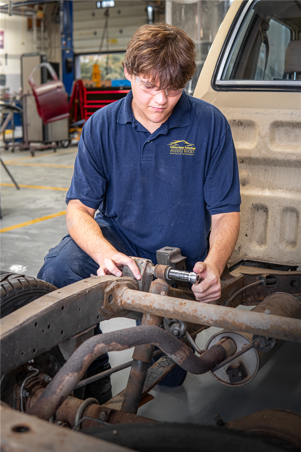 Collision Repair Technology students working on cars